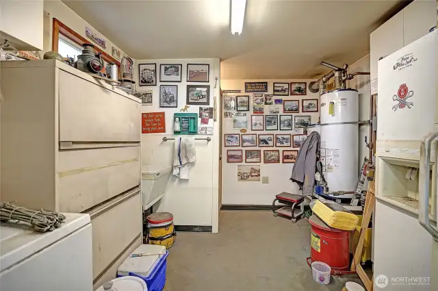 1/2 bath and washing machine for shop clothes.