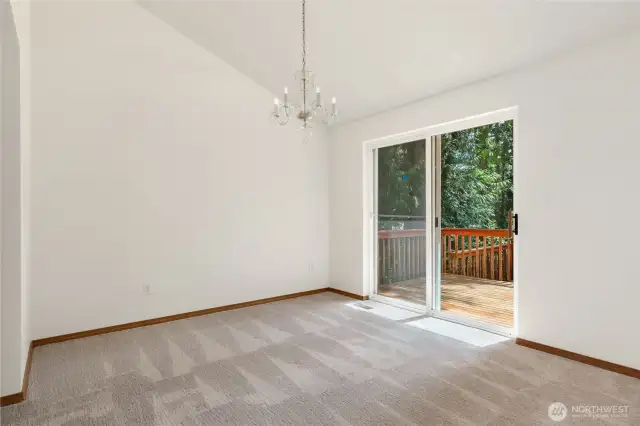 Dining Room with easy access to the deck for entertaining or just enjoying the peaceful surroundings.