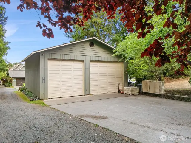 40 x 60 ft shop with tall garage doors and TONS OF POTENTIAL!!! Framed out room & stairs leading to a loft on the inside. Finish it out or break it down.