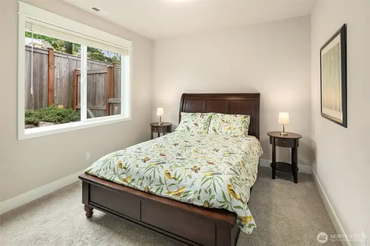 This main floor bedroom has en suite access to a full bath. It makes a great guest room tucked privately away from the 4 upper floor bedrooms or you could utilize it for multi-generational living.