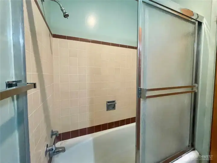 Owner's full bathroom in community hall.