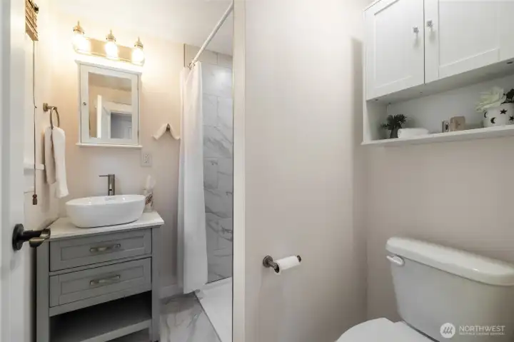 Downstairs bathroom adjacent to Laundry Room.