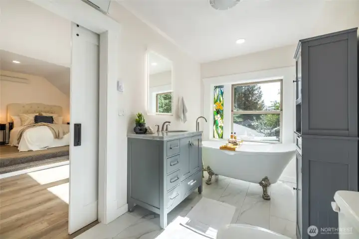 Good sized primary bathroom with all new plumbing fixtures and lighted mirror.