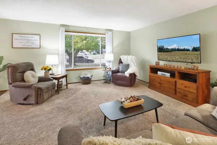 The cheery living room offers plenty of room to entertain.