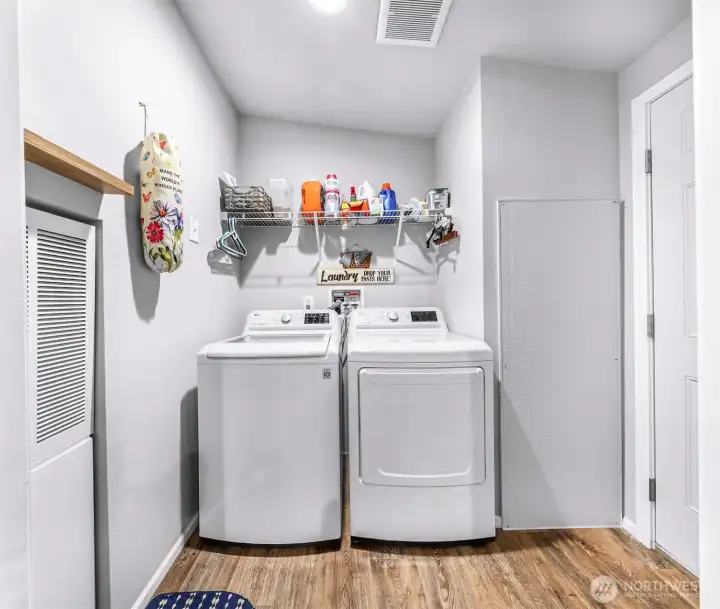 Laundry/utility room off of the kitchen with access to go outside.