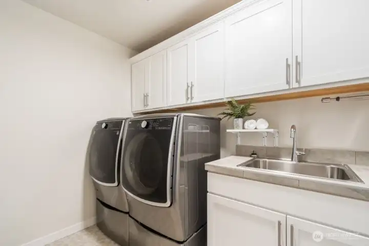 Upper level Laundry center with sink