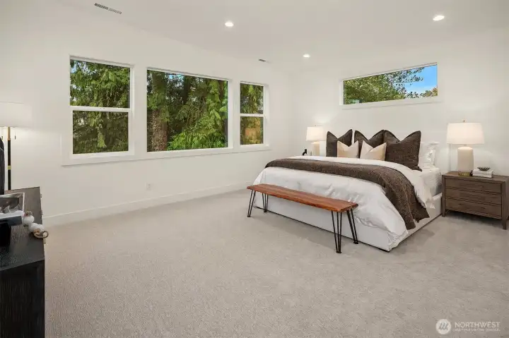 Designer primary suite with five-piece bath with heated floors