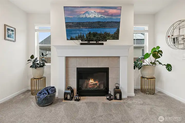 Cozy gas fireplace anchors the main living space.