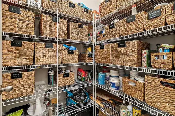 Spacious walk-in pantry keeps everything organized.