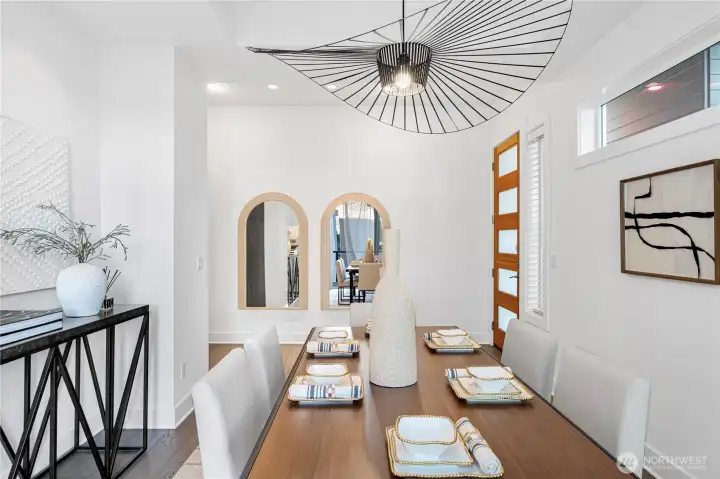 Beuatiful dining area with designer lights and balcony