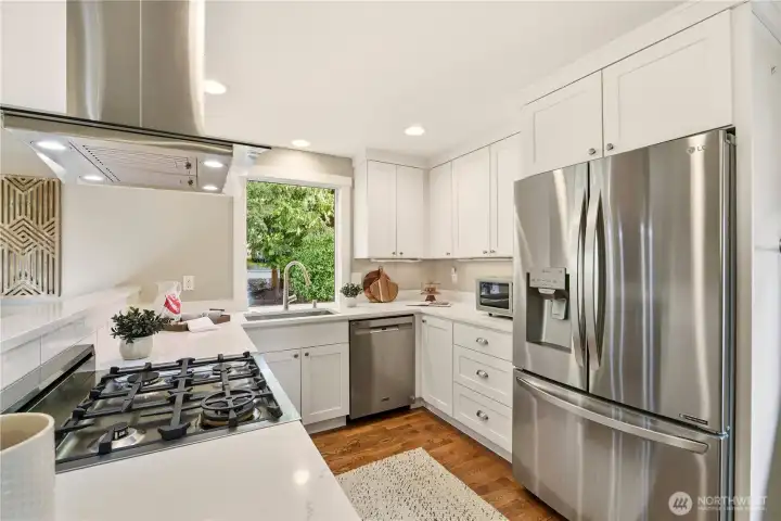 The remodeled kitchen is a Chef's dream with high end appliances, including a Bertazzoni stove, ceiling mount range hood, Quartz counters, slow close Shaker cabinets and drawers and undermount sink!
