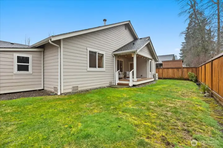 Yard that backs up to a tranquil space and includes a nice storage shed.