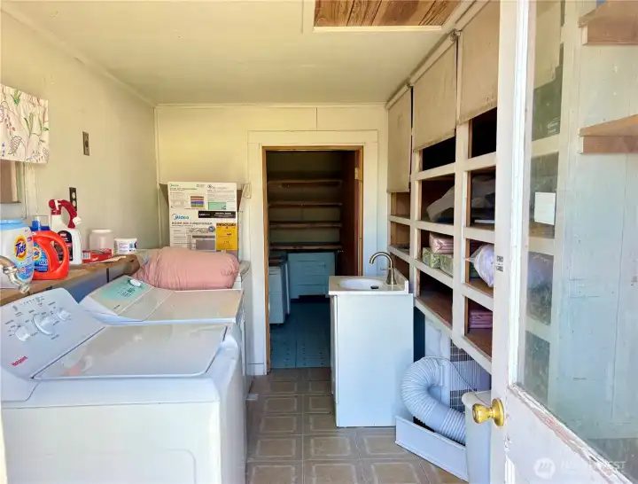 Laundry Room w/ tons of storage and pantry in detached garage
