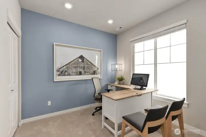 Main floor bedroom/den. Photo's are for representational purposes only. Colors and finishes may differ.