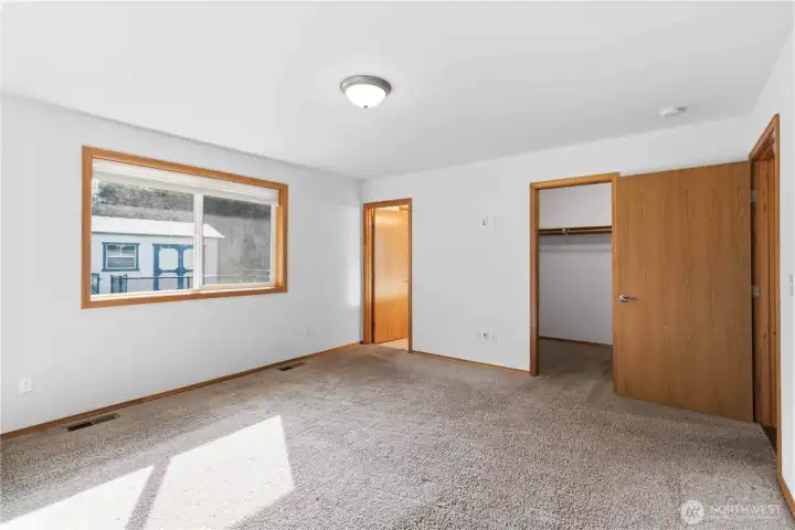 Primary suite with walk in closet & private bathroom.