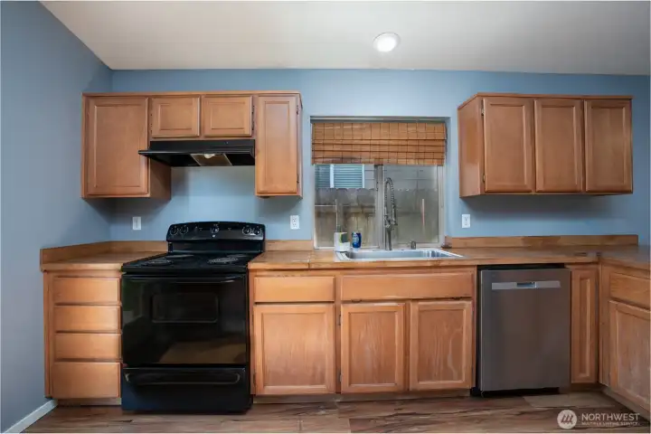 Functional kitchen with abundant cabinetry and counter space, perfect for staying organized and making everyday living easy.