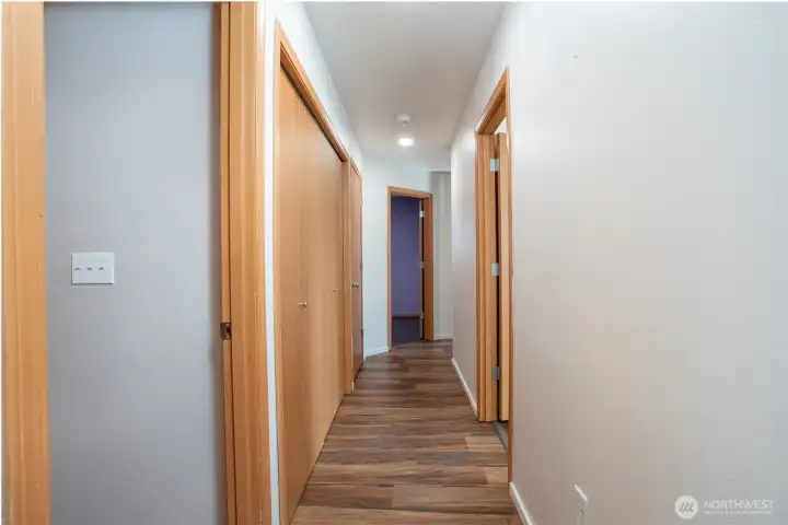 Well-designed hallway offering a smooth transition from living spaces to private bedroom areas.