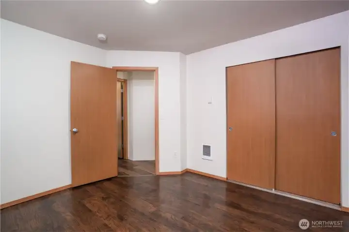 Well-sized bedroom featuring a spacious closet for added storage and organization.