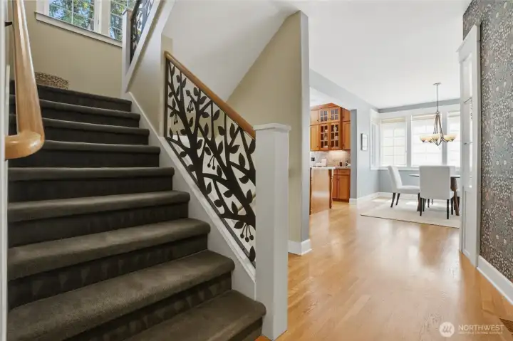 Stairs to the upper level and all bedrooms.