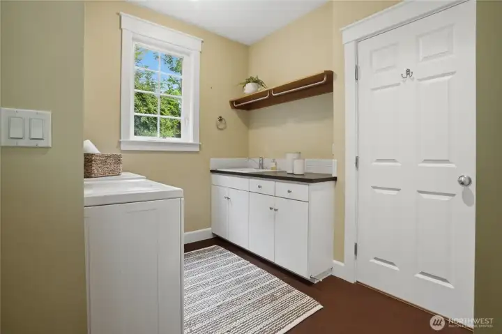 Laundry room with top quality Speed Queen washer and dryer.