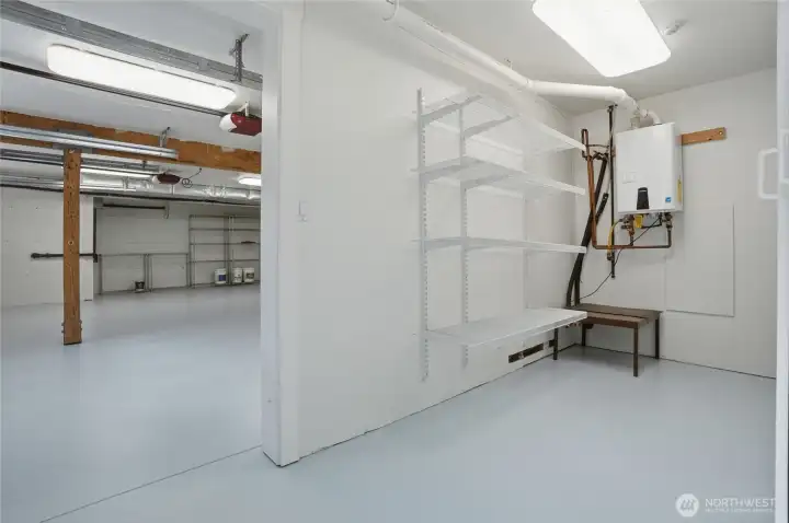 Storage room off the garage, with propane tankless water heater.