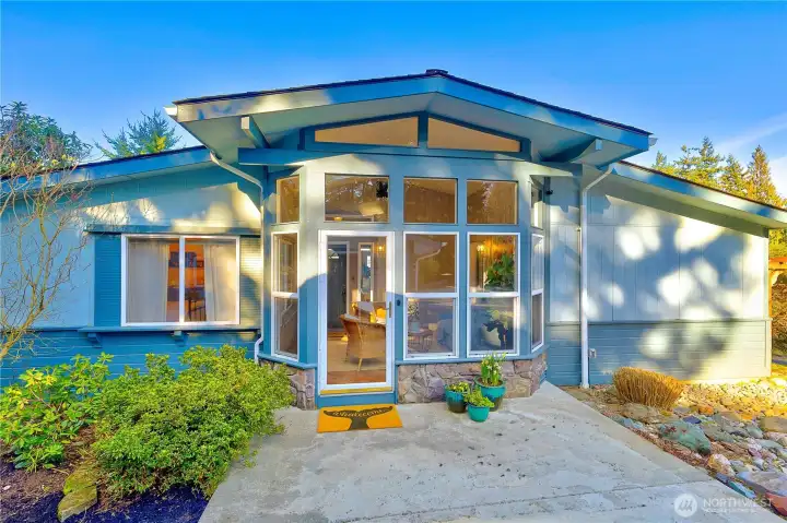 Additional 156 SQ FT Sunroom is a welcoming space!