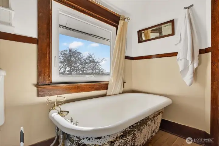 Top floor bathroom with original clawfoot tub.
