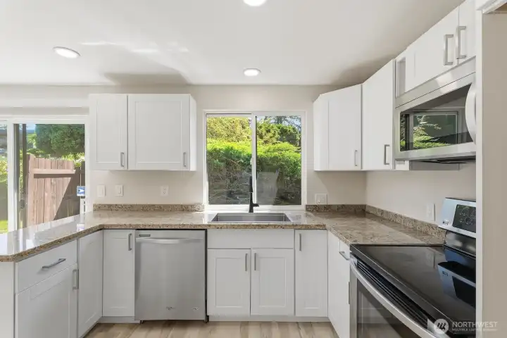Fully updated kitchen with new cabinetry, sink & countertops.