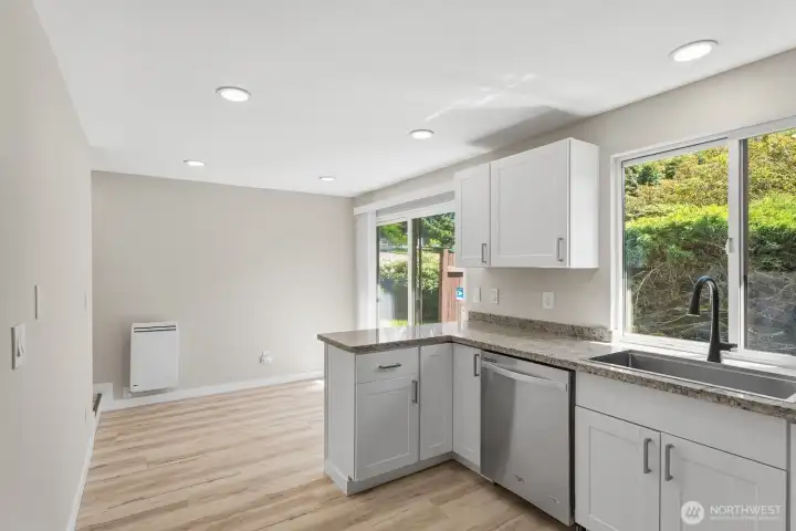 Eating nook off the kitchen opens to the private patio.