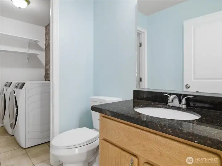 Downstairs 1/2 bath with laundry area
