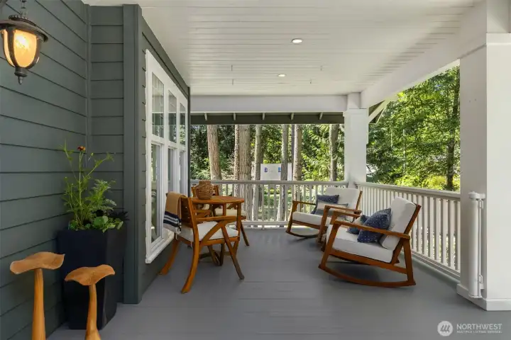 Designed for both comfort and curb appeal, this expansive covered front porch creates an inviting outdoor living space perfect for morning coffee, evening conversations, and effortless relaxation