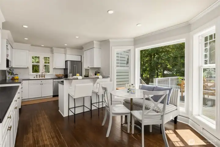 Sun drenched breakfast nook and eat in kitchen perfect for entertaining and daily living.