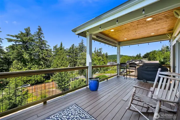 Convenient covered area, perfect for grilling year round - and plumbed for gas.