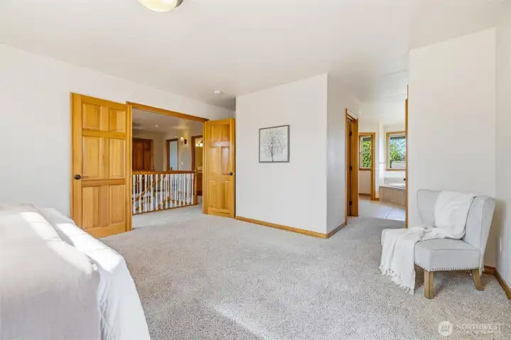 French Doors open into Primary Bedroom, Bathroom Ensuite w/ Walk in Closet