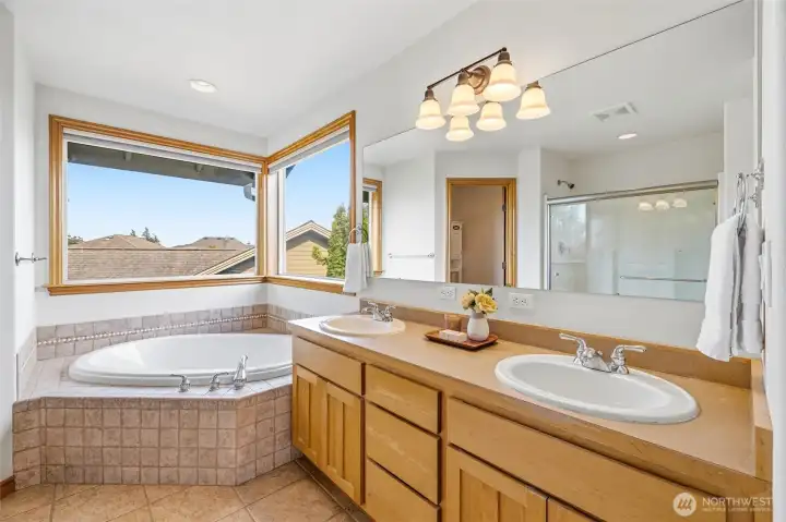 Primary Bathroom, featuring Dual Sinks and an Oversized Soaking Tub