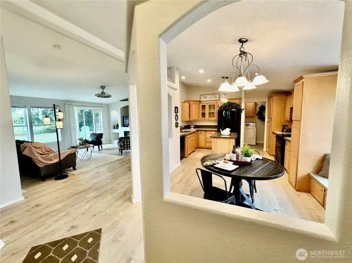 Front entry view as you entry from the front door...dining/kitchen and laundry area on the right, straight ahead is the vaulted living room with access to the rear deck and fenced backyard.