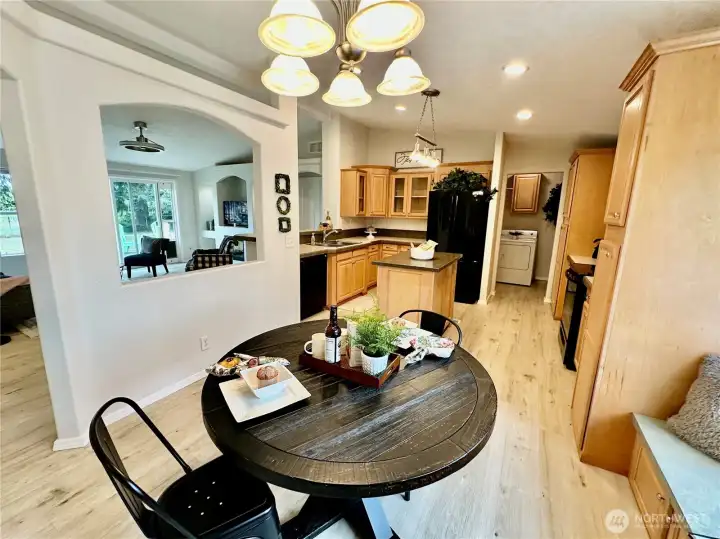 Inviting dining area with built-in window seat with storage below.