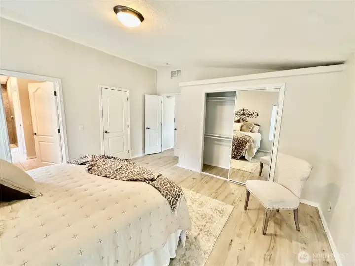 Another view...this shows the closet behind the glass sliding doors and access to the walk-in closet and private bath.