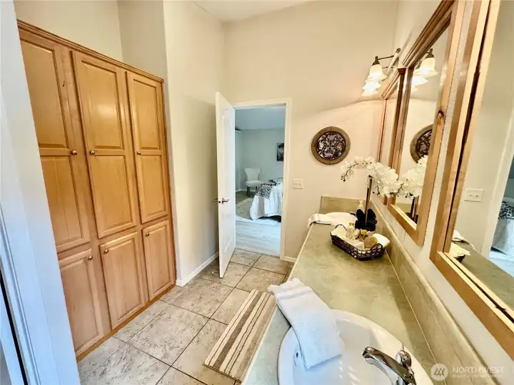 This shows the bath linen storage...