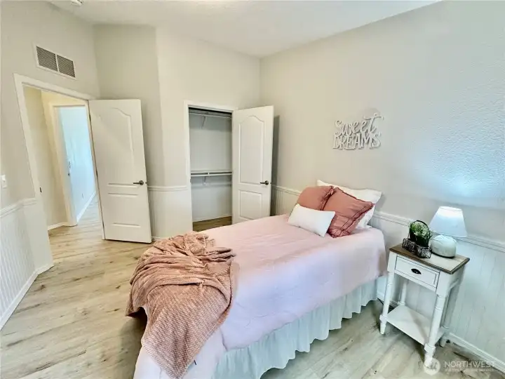 2nd bedroom with wainscoting and nice closet space.