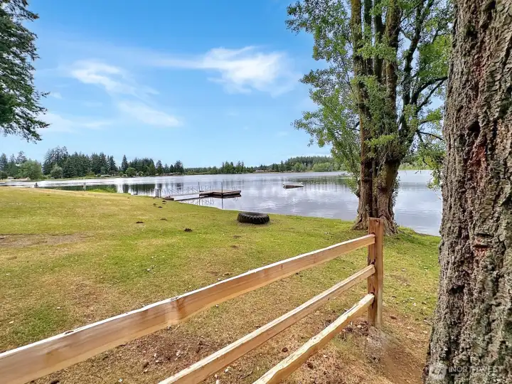 In this photo you see the park of the community park with dock for swimming.