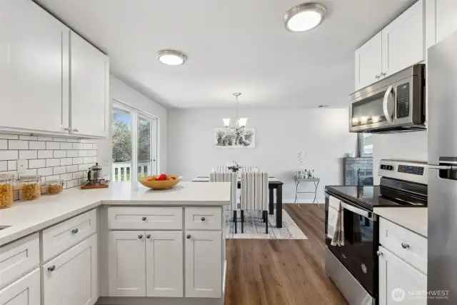 Kitchen looks out to dining