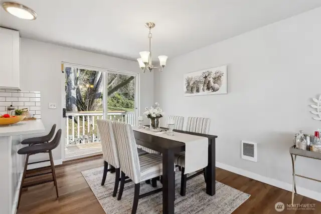 Dining room with sliding doors to deck and backyard