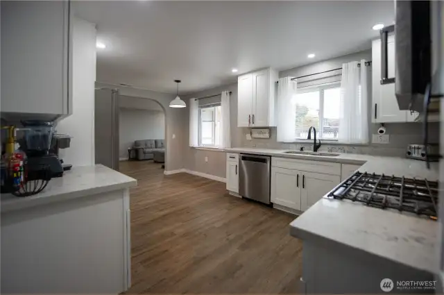 Bright open kitchen with quartz counters