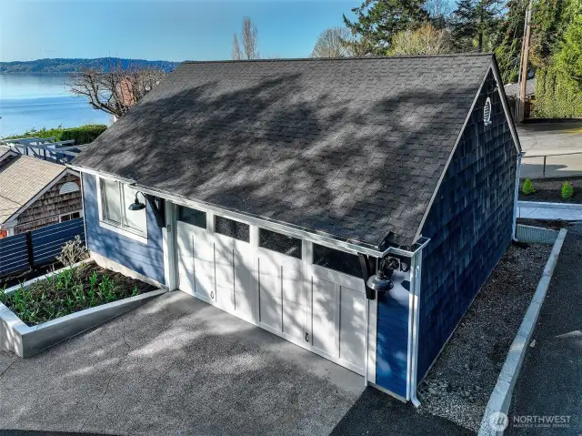 Tucked discreetly above the shoreline estate, the coach house offers both convenience and charm—ideal for guest quarters, a creative studio, or secure garage parking. Perched at street level with its own entrance, it’s the first glimpse of a property that unfolds like a story—one that begins with water views and ends in wonder.