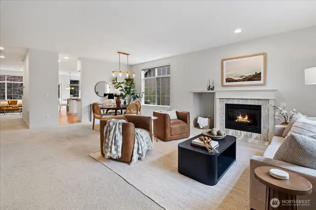 As you enter, a large living room seamlessly flows to the formal dining space.