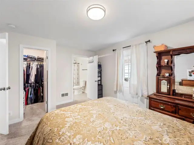 Primary En Suite with 3/4 bathroom and walk-in closet