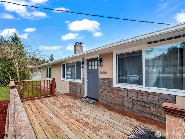 front of house w/ wooden deck