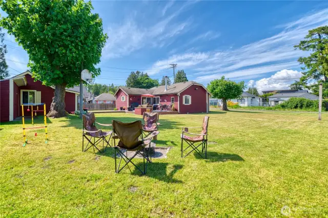 View of primary home, fantastic yard and guest cottage