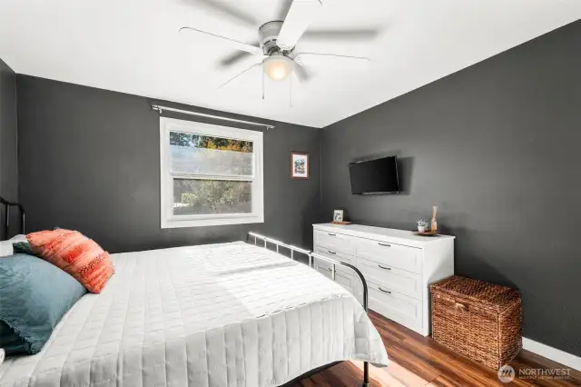 Primary bedroom is tucked away in the northwest corner of home looking out over the backyard.